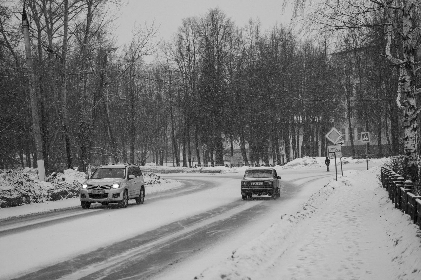 A black SUV on a snowy highway in winter, the kind of drive the Niagara route can become
