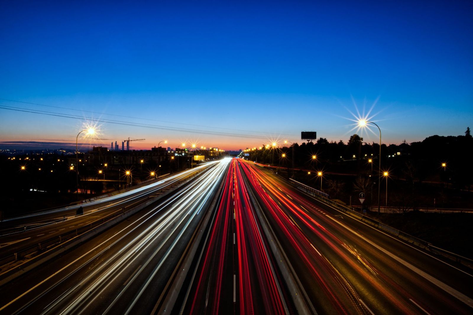 Evening traffic with headlights on a multi-lane highway near Toronto