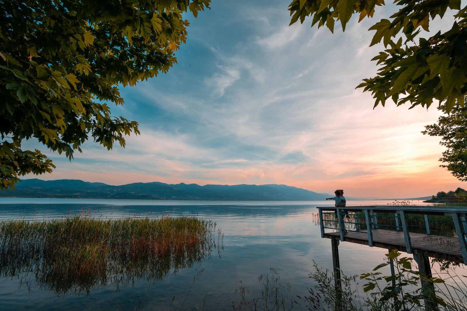A lakeside boardwalk at sunset, the kind of evening walk that a chauffeur-timed pickup makes easy on the Barrie waterfront