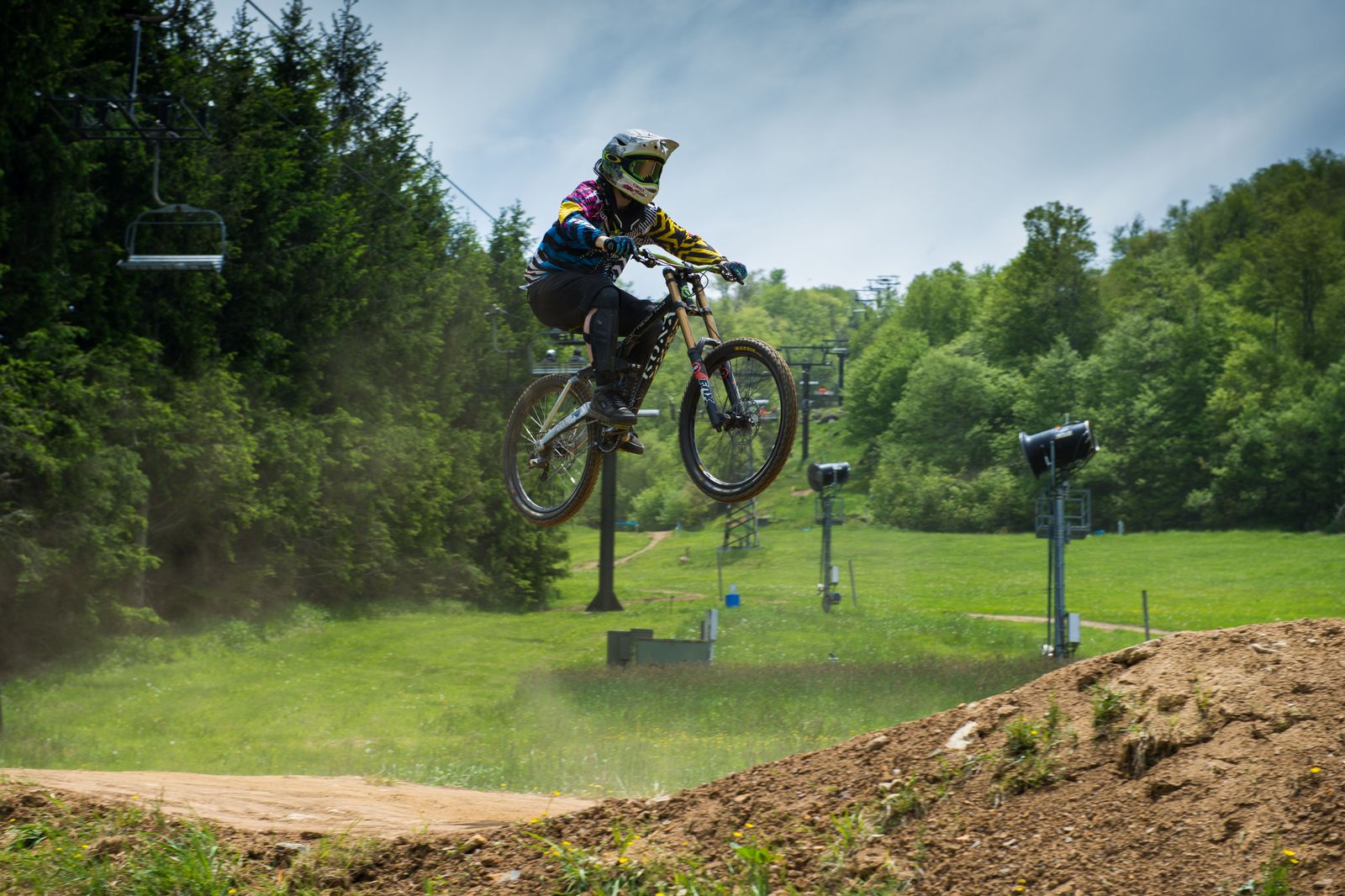 A mountain biker riding a downhill trail, the summer reason to visit Horseshoe Valley