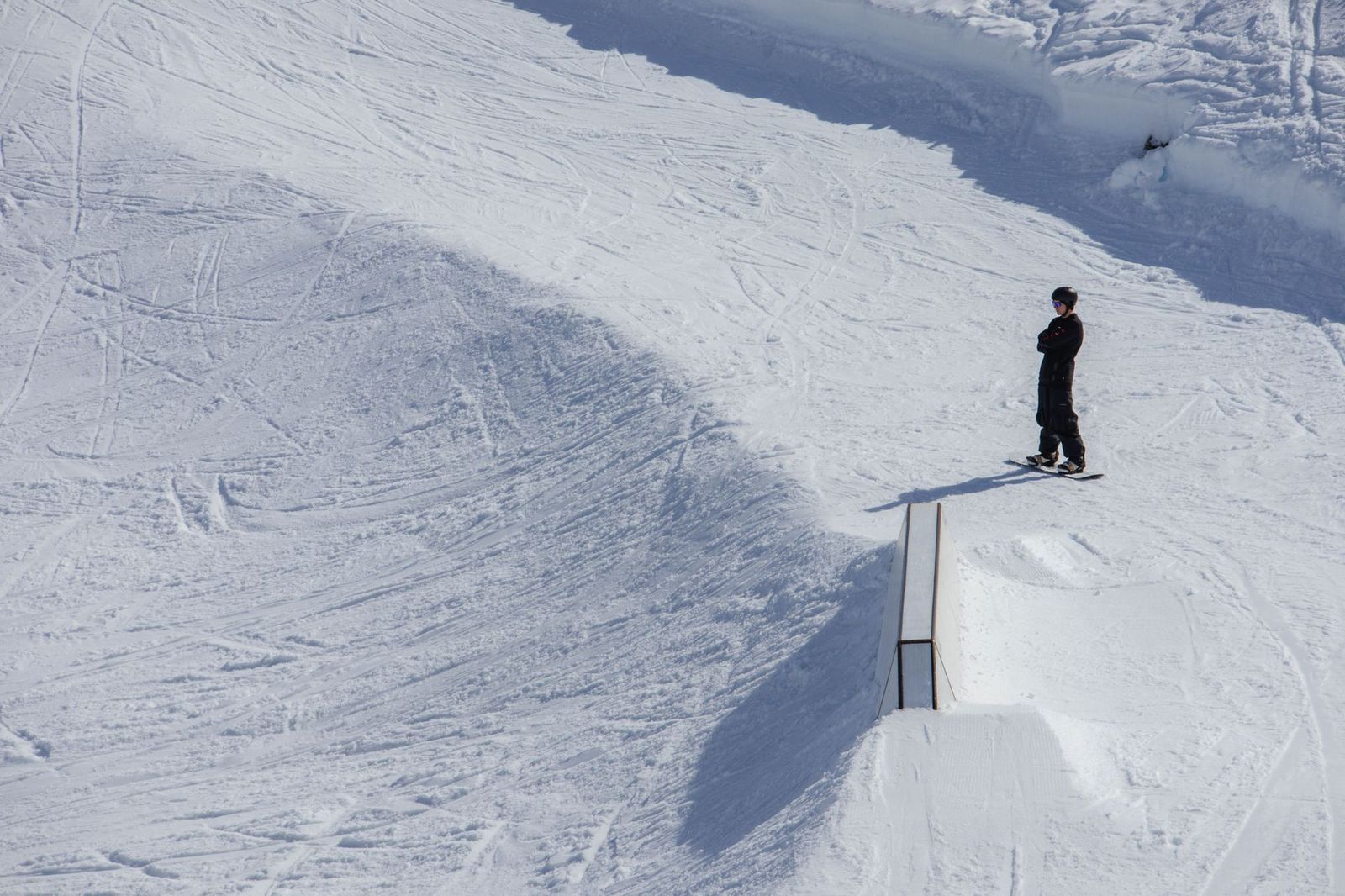 A snowboarder launching off a terrain park jump, the freestyle terrain Moonstone is known for