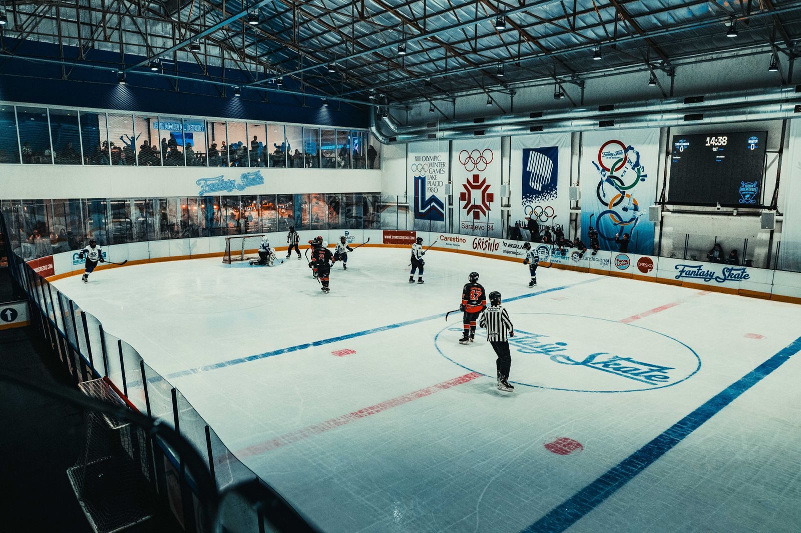 Players battling for the puck in an indoor ice hockey game, the kind of night that Sadlon Arena hosts for the Barrie Colts