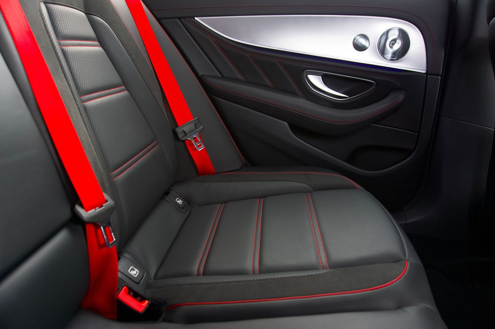 The rear seat of a black SUV with a clean leather interior