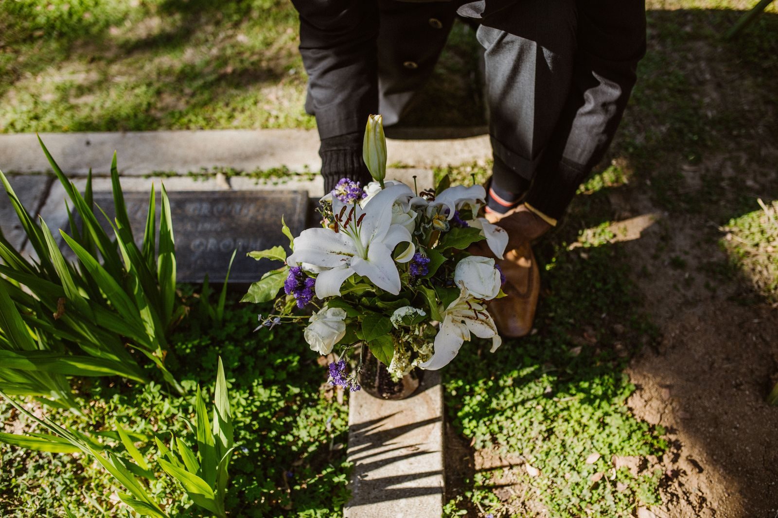 White lilies on a stand beside the door of a church before a service