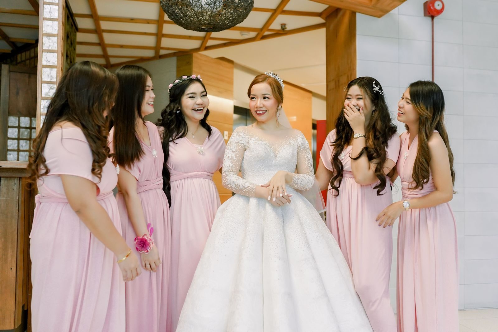 Students in prom dresses and suits posing for a group photograph