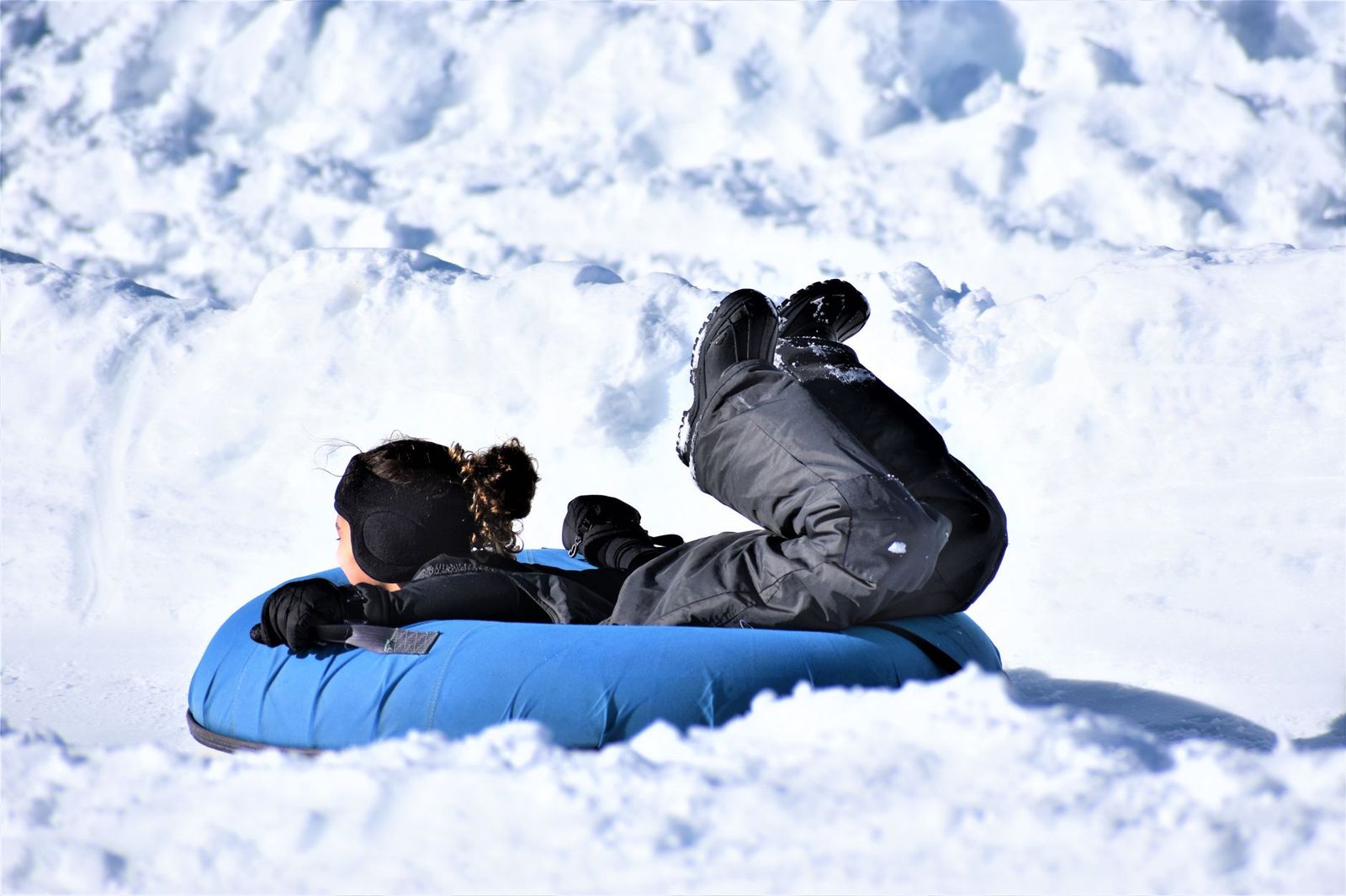 A family snow tubing at a Simcoe County ski hill