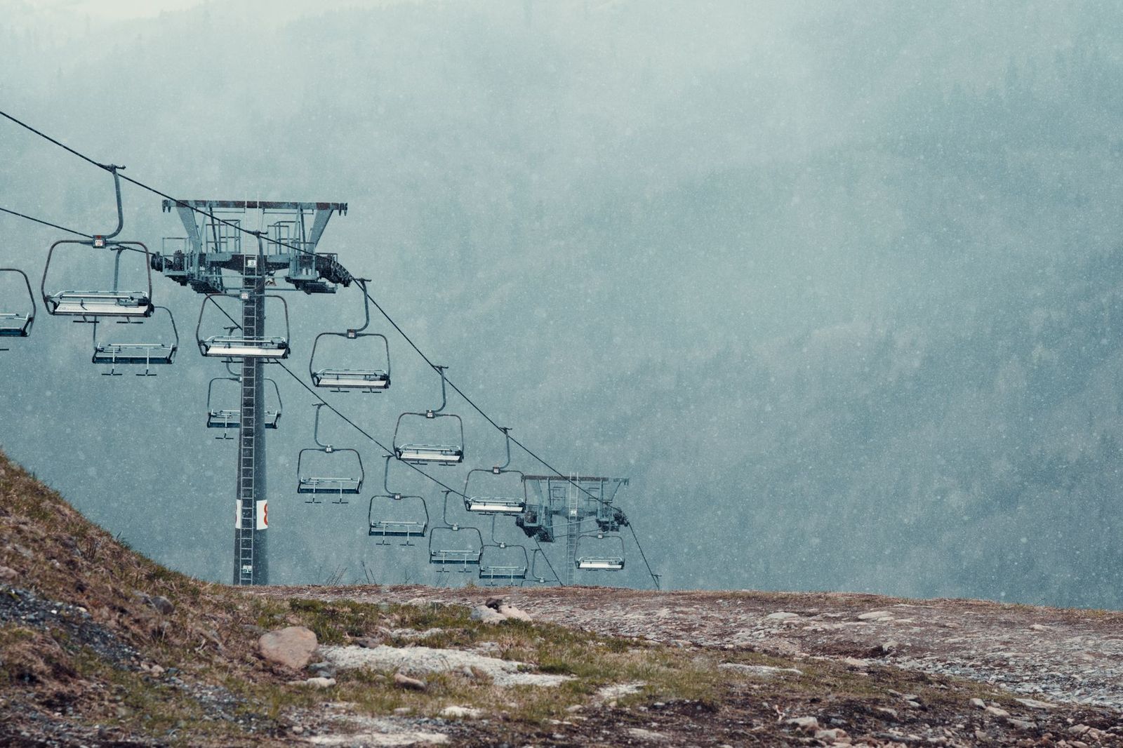 A chairlift above a snowy hill, the winter reason many Springwater bookings begin at dawn