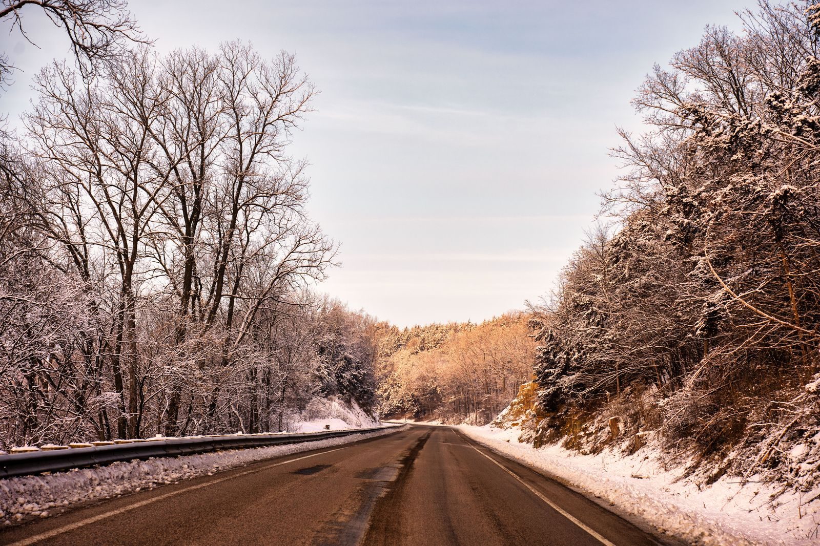 A highway disappearing into a snow squall in winter