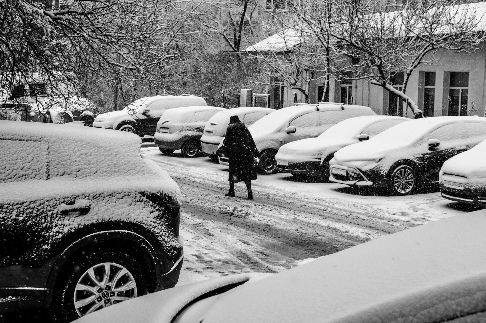 A black SUV in the snow outside the arena on a Colts game night