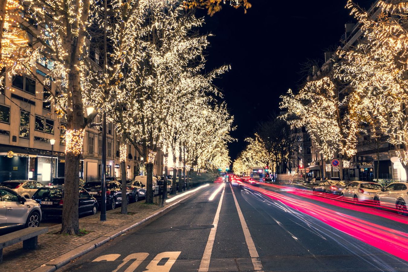 Christmas lights on a snowy street in the evening, the setting for a chauffeured holiday outing