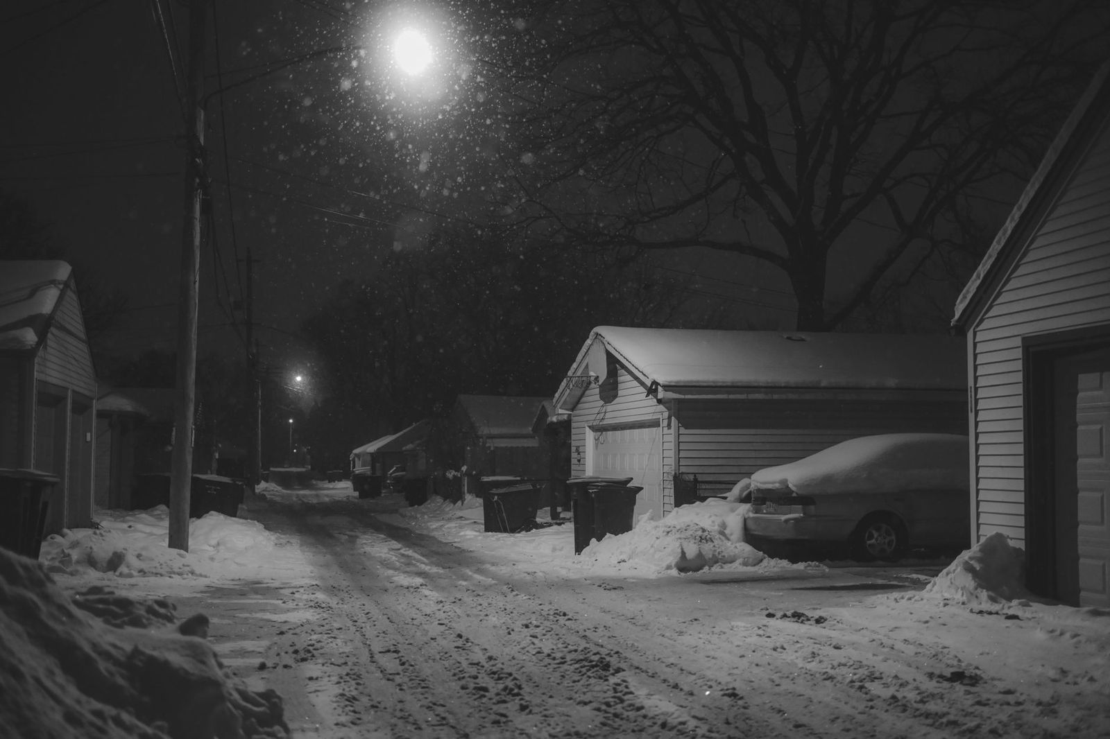 A black limousine on a snowy winter night