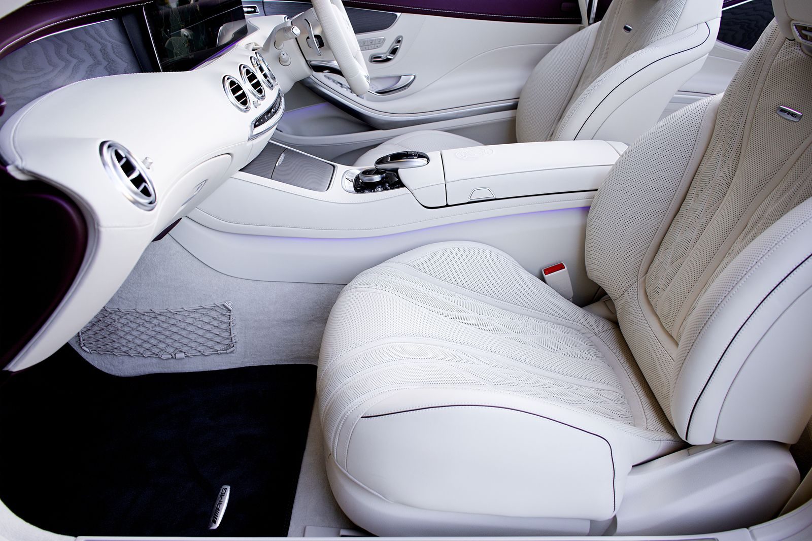 The interior of a stretch limousine with leather seating along both sides