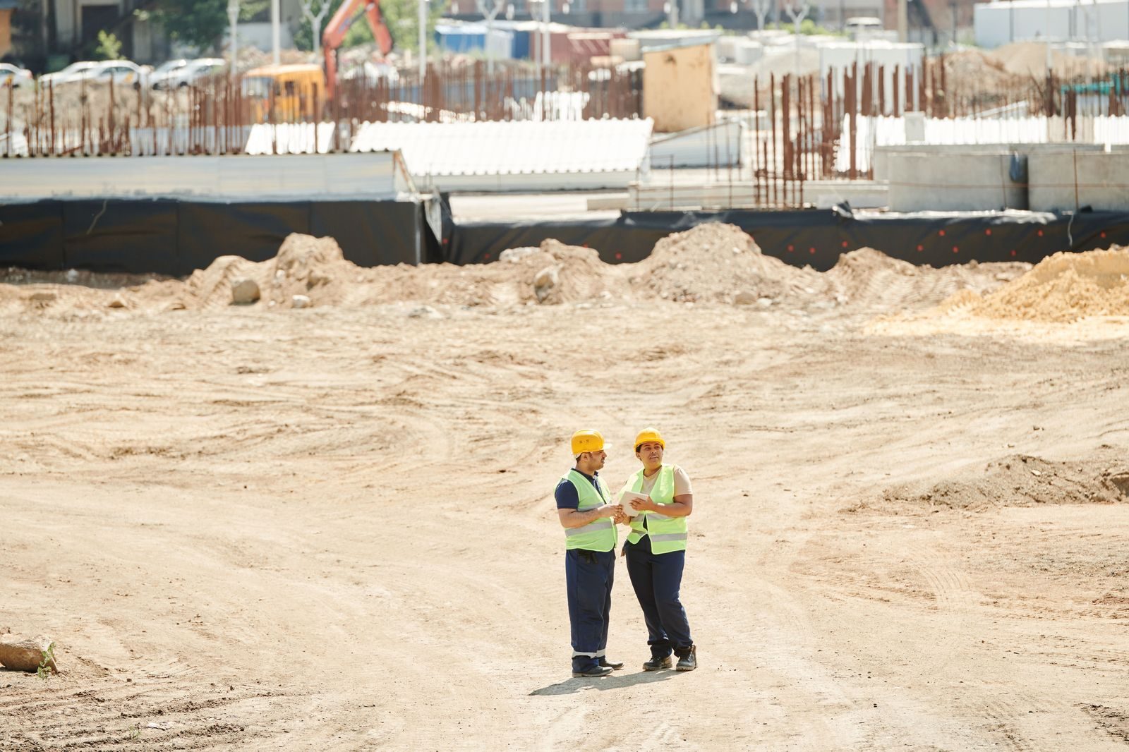 Workers in hard hats at an industrial plant
