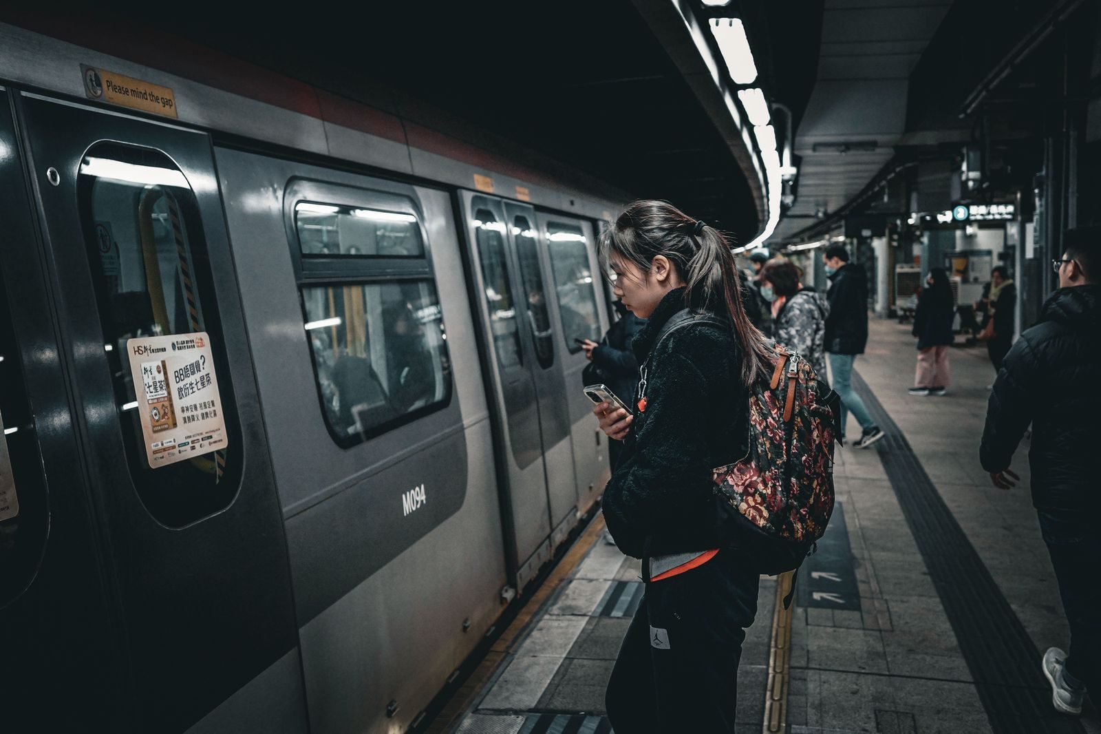 Passengers waiting on a commuter rail platform at Toronto Union Station