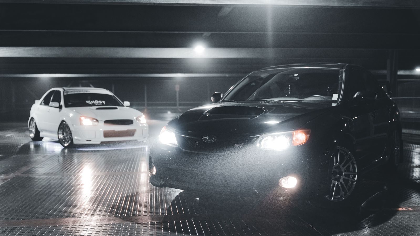 Black business sedan on a winter night in Barrie