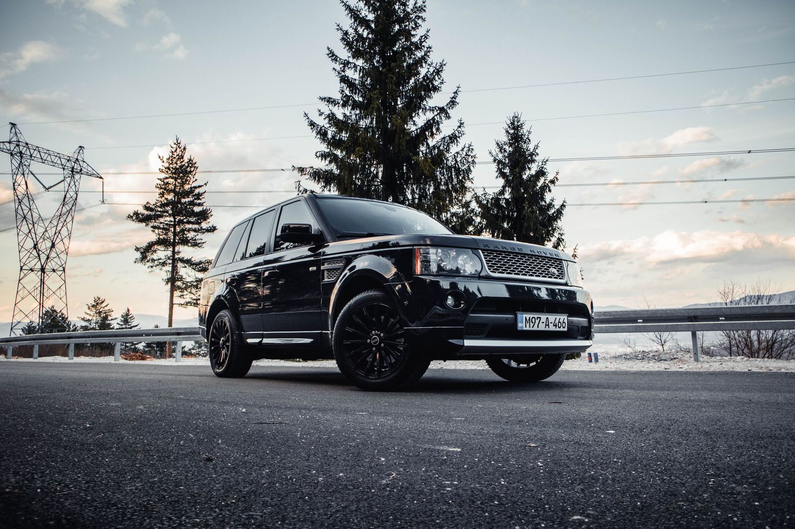 A black SUV on Highway 400 in morning light: a private car runs to your flight time, not an operator timetable