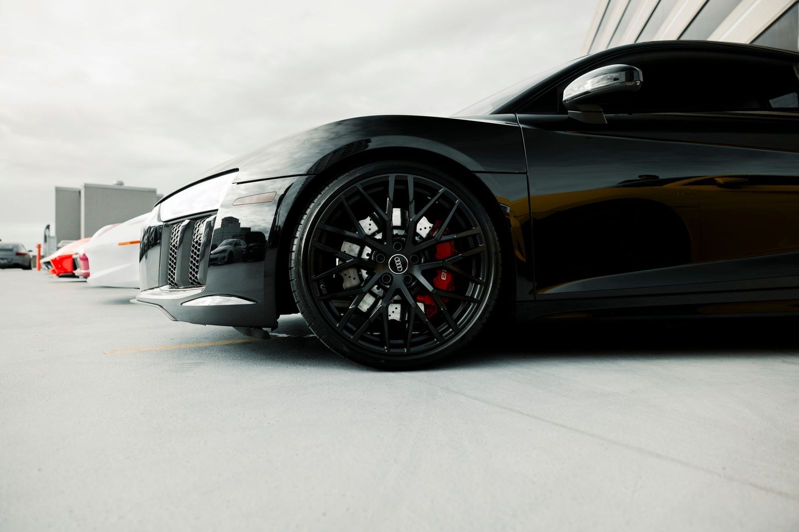 Black luxury vehicles lined up, the own-fleet sedans and SUVs that handle most Barrie limo bookings