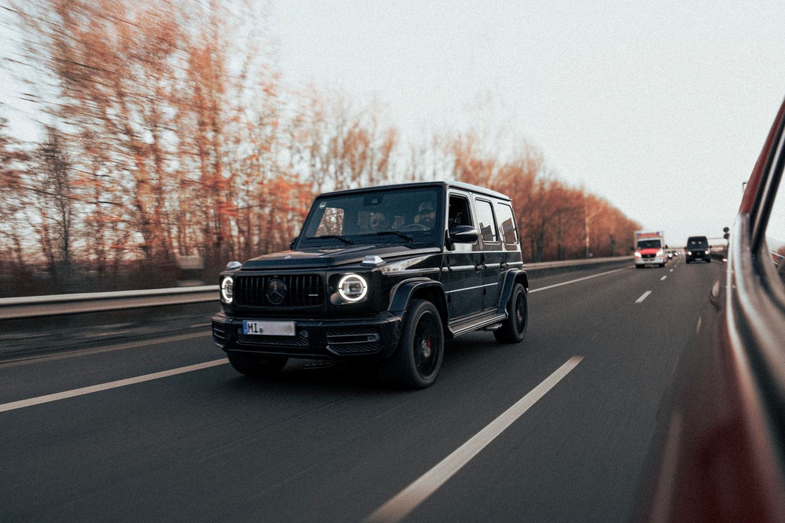A black SUV on a snowy highway, the vehicle most private chauffeur clients choose for winter days in Simcoe County